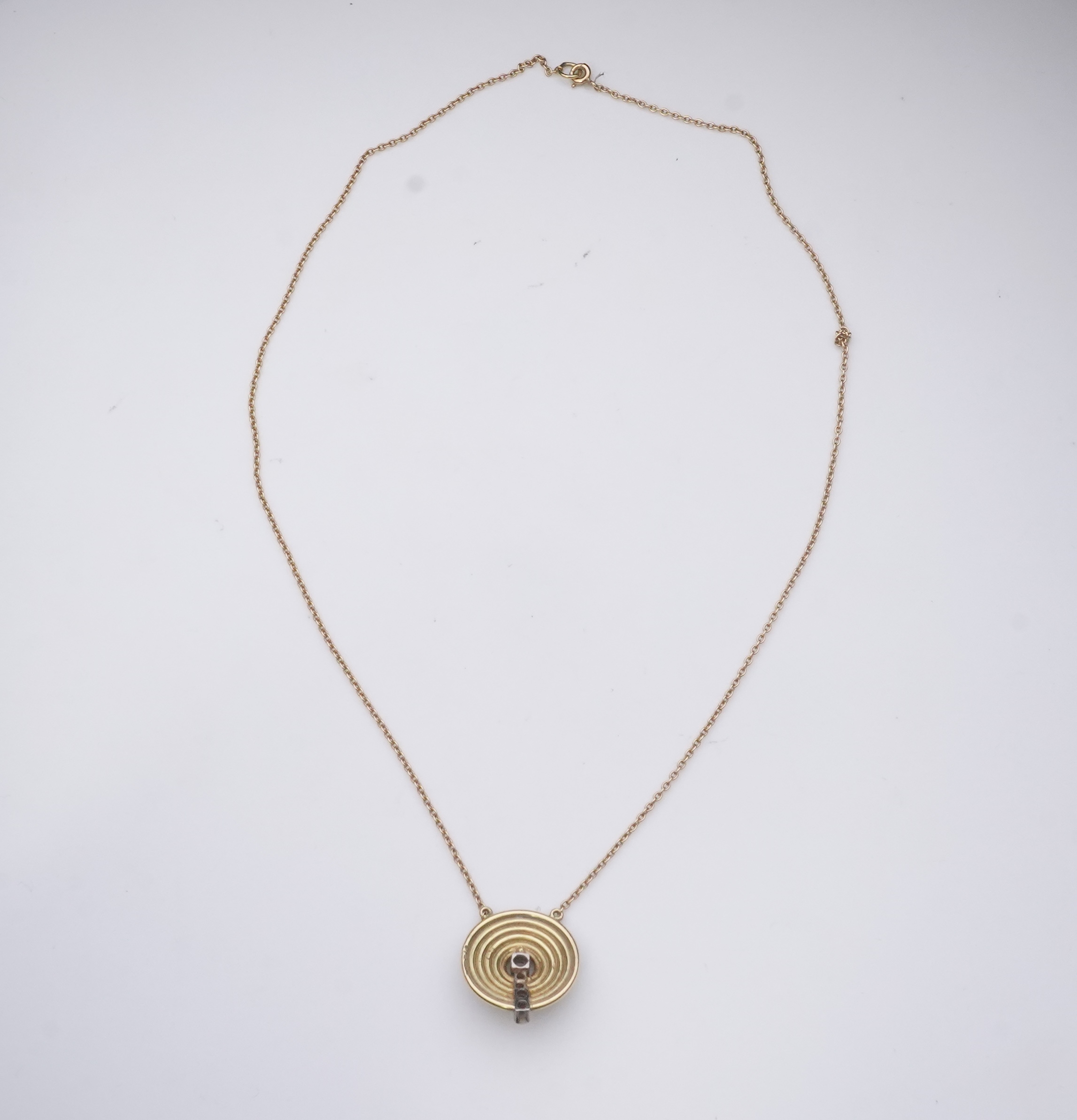 An 18ct gold and diamond pendant, circa 1978